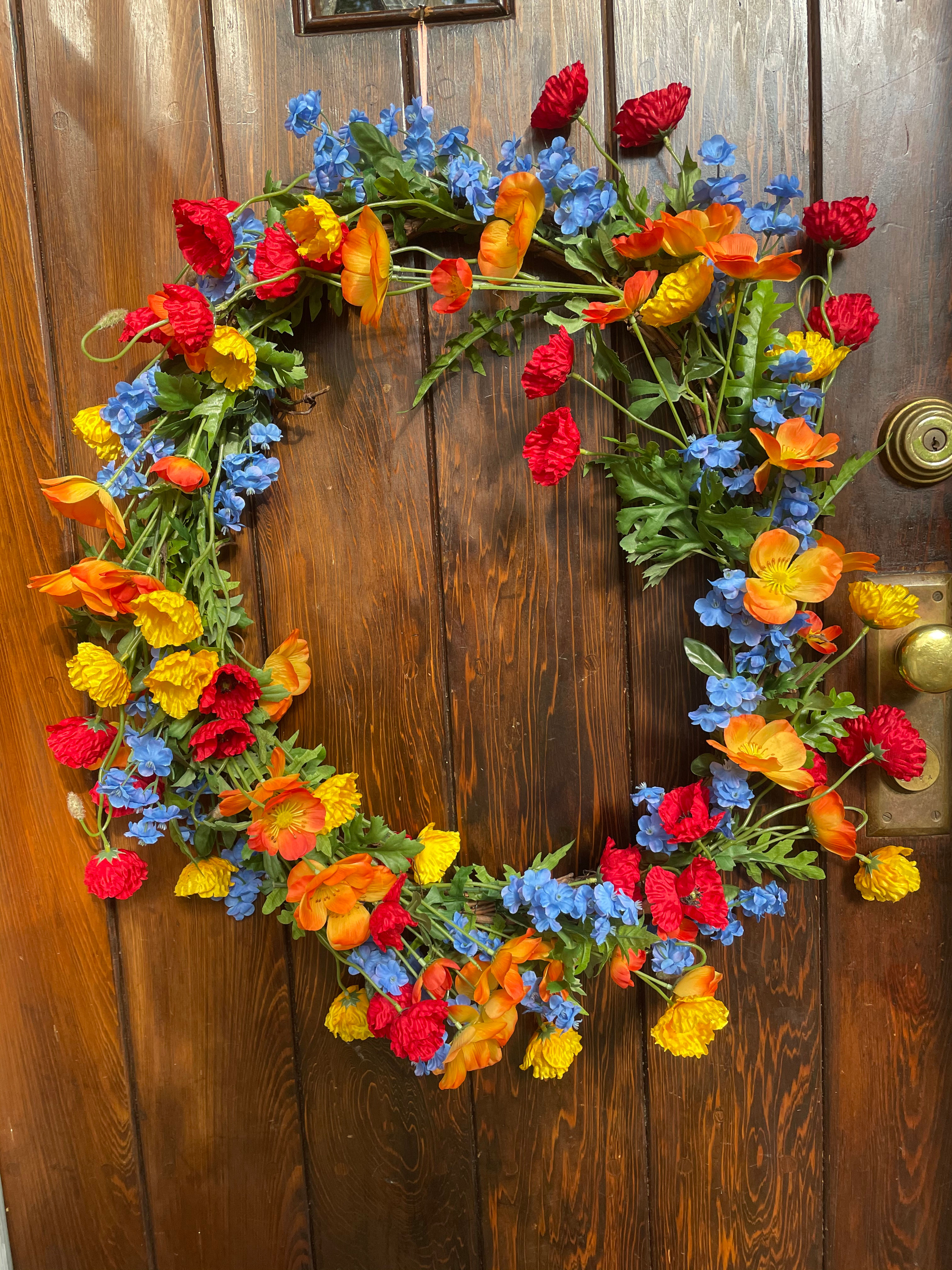 34) Orange, Red, Yellow, Blue Flowers and Poppies on a Vine Wreath