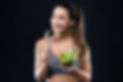 beautiful-young-woman-eating-salad-black-background.jpeg