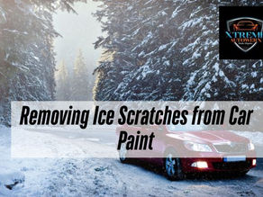 Red car on a snowy forest road with Xtreme Autowerx branding and the text “Removing Ice Scratches from Car Paint.”