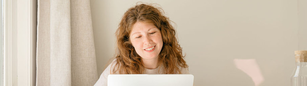 Julia on a call with a client on the laptop
