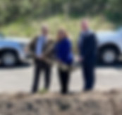 County Commission President, Agnes Queen, stands alongside County Comissioners, Robert Stewart and Roderick Wyman, while posing for a photo during a groundbreaking ceremony.