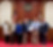 911 Director, James Gum, accepts an award while standing for a group photo.