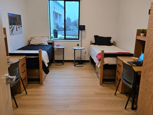 A student dorm room showing two beds