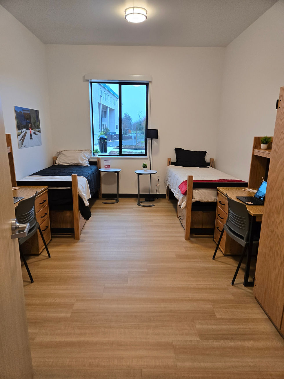A student dorm room showing two beds