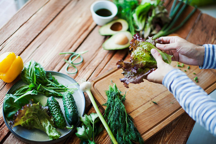 Hands cutting vegetables
