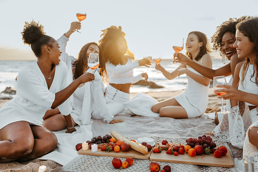 group-happy-women-female-friends-having-cozy-summer-picnic-with-wine-champagne-having-hen.