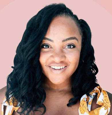 A woman with brown hair smiling in front of a pink background. 