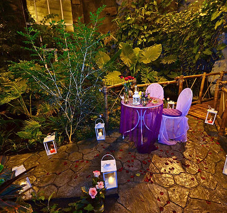 In a tropical greenhouse (in the jungle) Romantic dinner