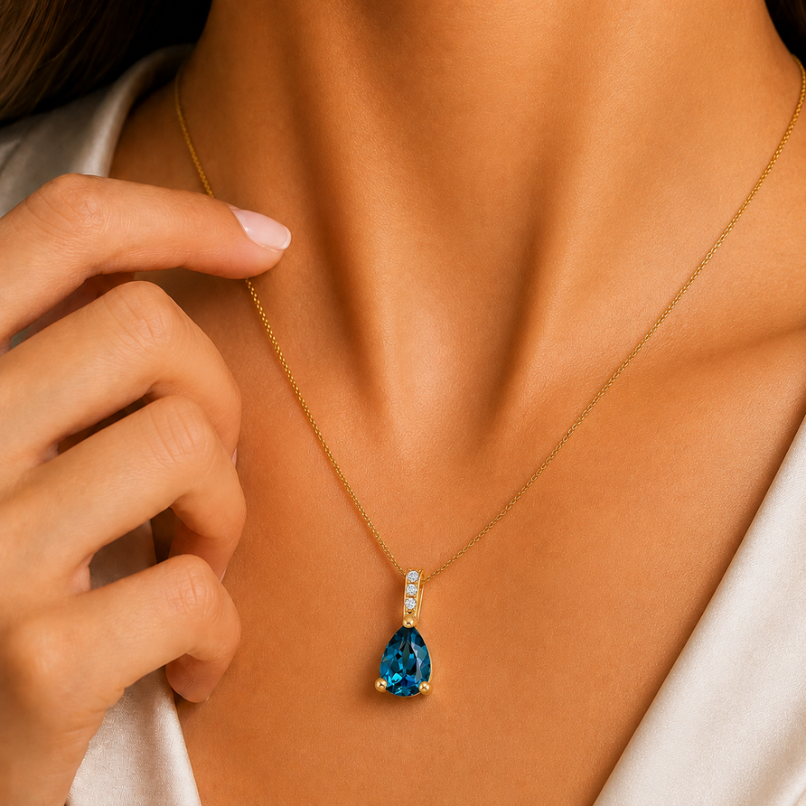 925 Sterling Silver Pear Cut London Blue Topaz Pendant Necklace, Yellow Gold Plated