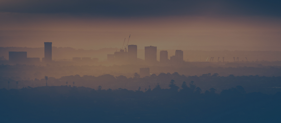 skyline of a smoggy city - Environmental Liability Insurance