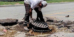 parking-lot-asphalt-repair-collapsed-drain-manhole-covers-reset-babylon-ny.jpg