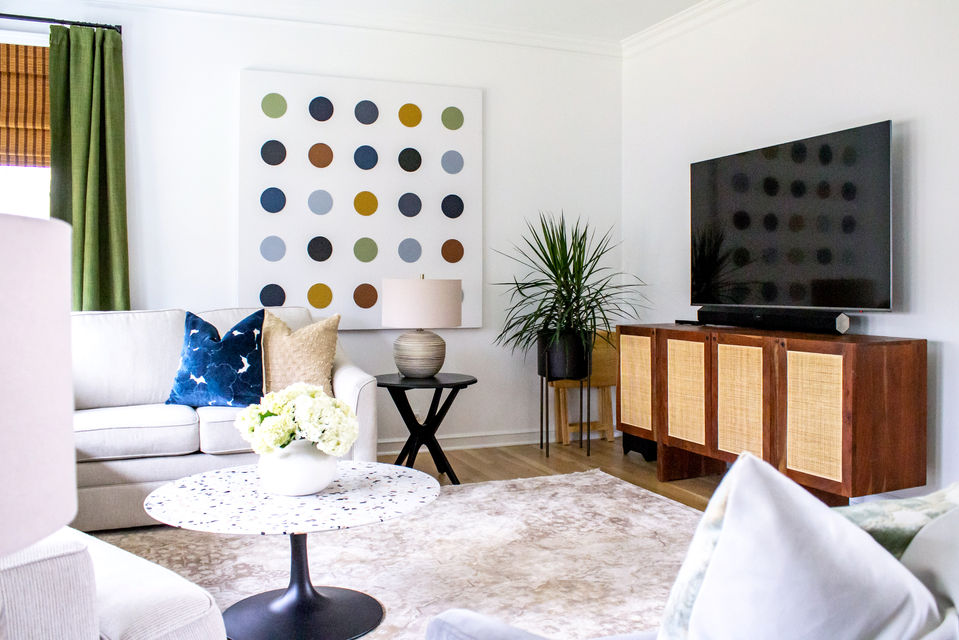 Living room with colorful art and stylish decor, Oakview Home.