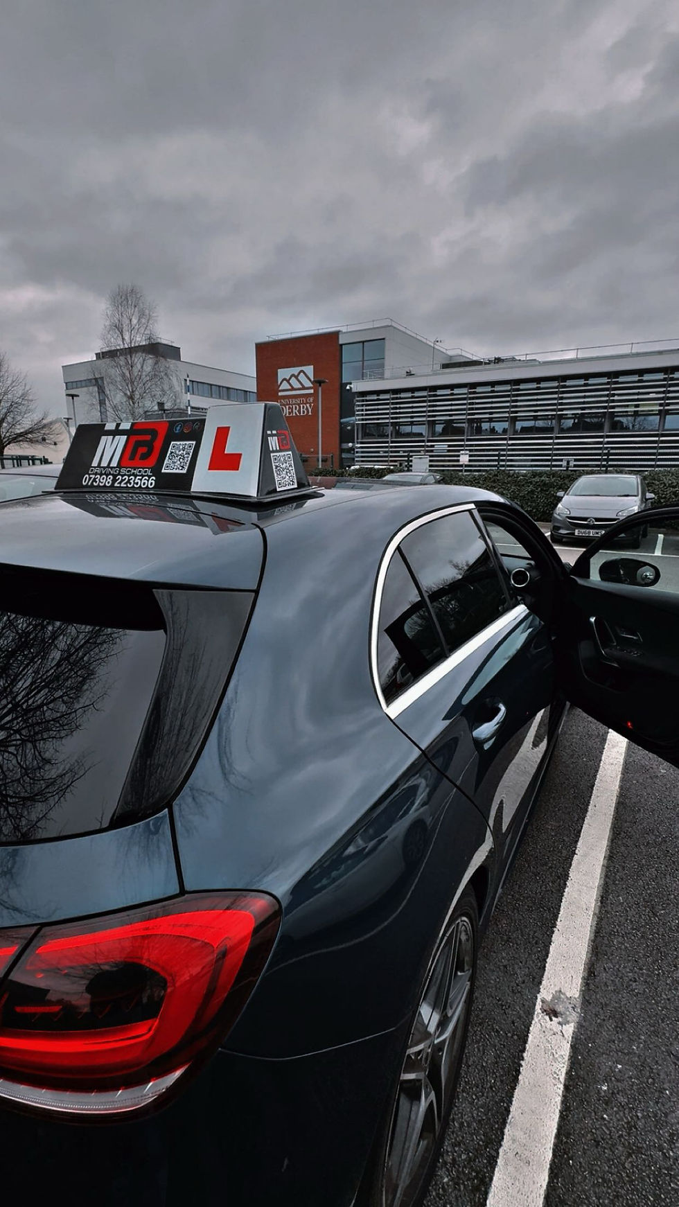 Learner driver feeling nervous during a manual driving lesson in Derby while receiving calm guidance from a professional driving instructor to build confidence and safe driving skills.