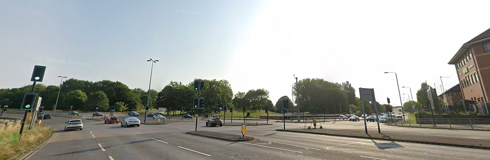 Busy Derby road with traffic lights, showing learner driver navigating city traffic safely