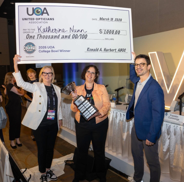 Photo 2: Katherine Nunn, winner of the UOA College Bowl, holds the trophy at Vision Expo Orlando.
