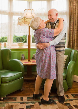 Older couple celebrating their new home.