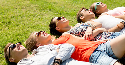 Friends Relaxing on Grass