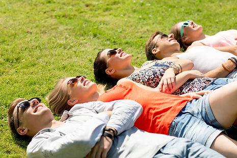 Friends Relaxing on Grass