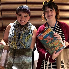 Emily Friedman and Emily Kugler with D&D and TRPG materials