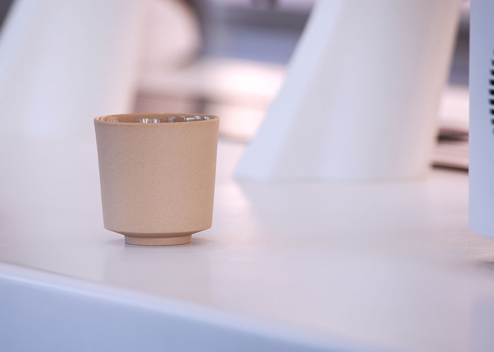 Thumbnail: Front view of a minimalist, Japanese style ceramic cup in beige on a white modern background.