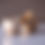 Thumbnail: Front View of two minimalist, round Cortado cups in matte brown with white swirls on a marble surface. One on it's side.