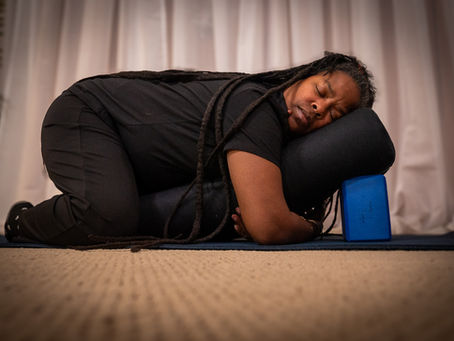 Tuesday Irby practices supported child's pose