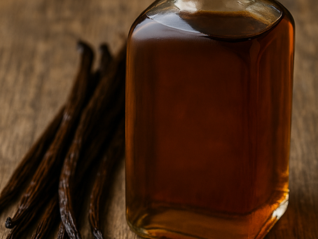 A bottle of high quality vanilla extract with whole vanilla beans and seeds — the heart of pure flavor.