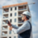 man taking photo of construction project