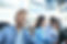 smiling-call-center-employees-sitting-line-with-their-headset.jpg
