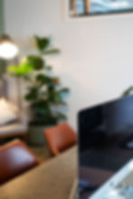 Close-up of a sleek computer setup in a well-lit private office at Flockd.