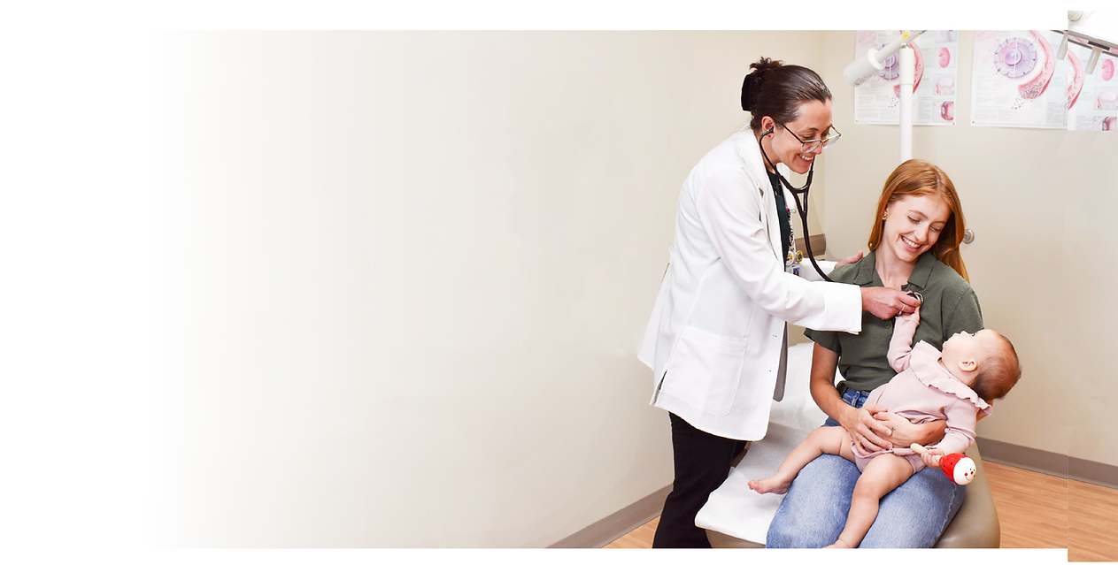 Physician, mother and baby in an exam room