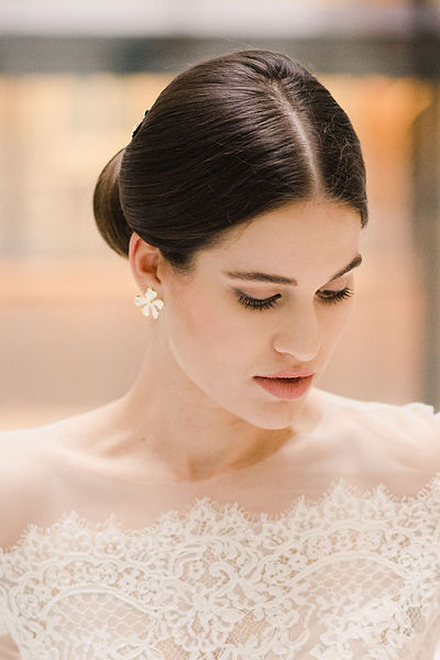 Introducing our enamel orange blossom earrings, a modern and elegant choice that pays homage to the historic bridal style of Queen Victoria. These earrings feature delicate enamel orange blossoms adorned with 24k golden gilding. Queen Victoria, the first royal to wear a wreath of orange blossoms alongside her diamond jewelry, was an inspiration for our "Victoria" jewelry set. Elevate your wedding day style with a touch of regal heritage and timeless beauty.