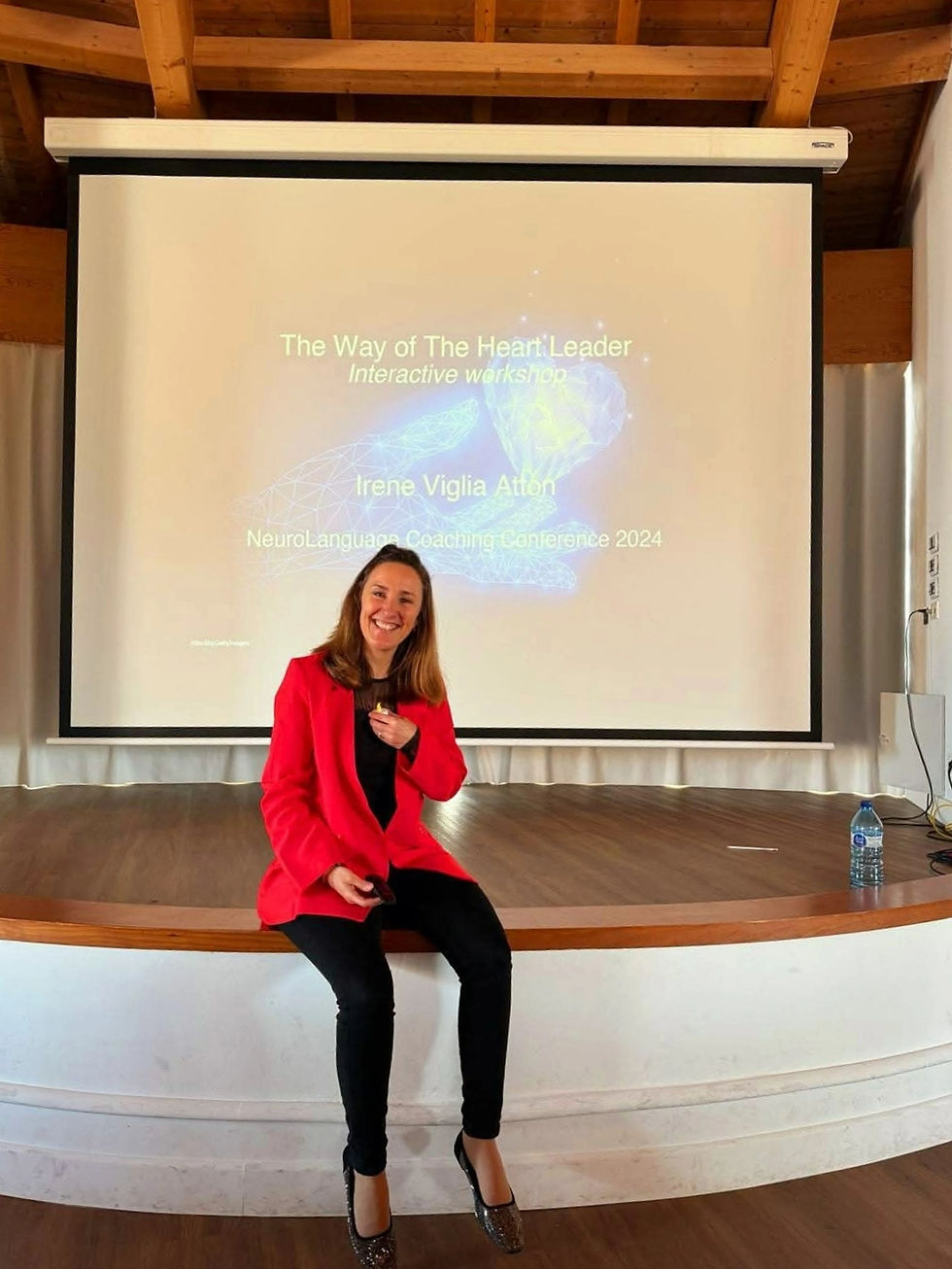 Irene Viglia Atton speaking at a conference.