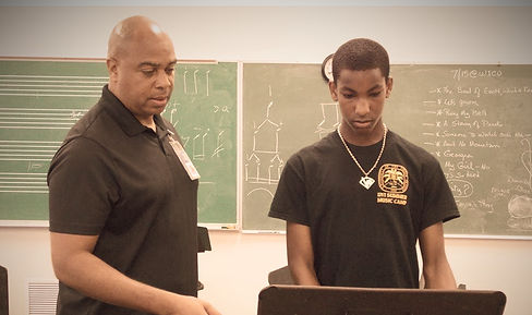 UJF Founder Dion Parson with student.jpg