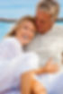 seniors on beach laughing tall.jpg