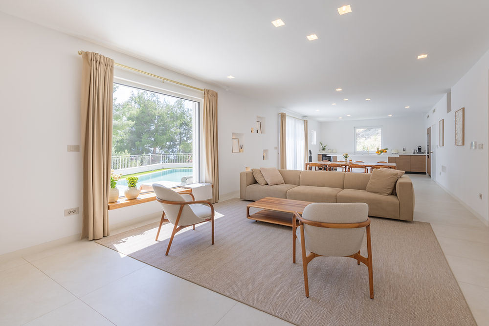 Spacious living room of Villa C with pool view