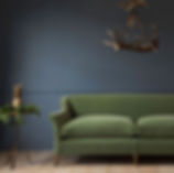 Dark blue wall with same colour dado rail and skirting