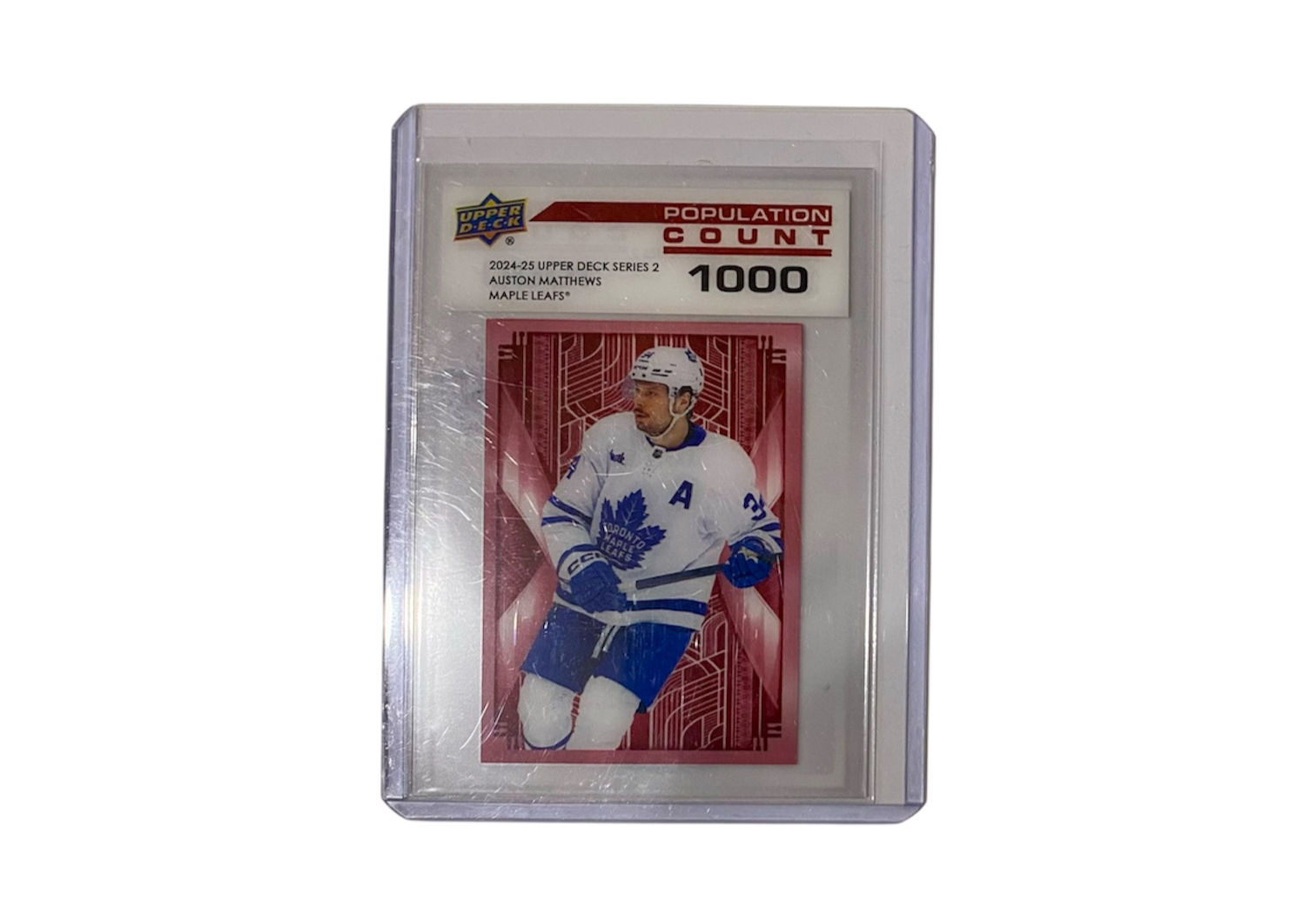 Auston Matthews hockey card Upper Deck 1000 with Leafs jersey in clear case.