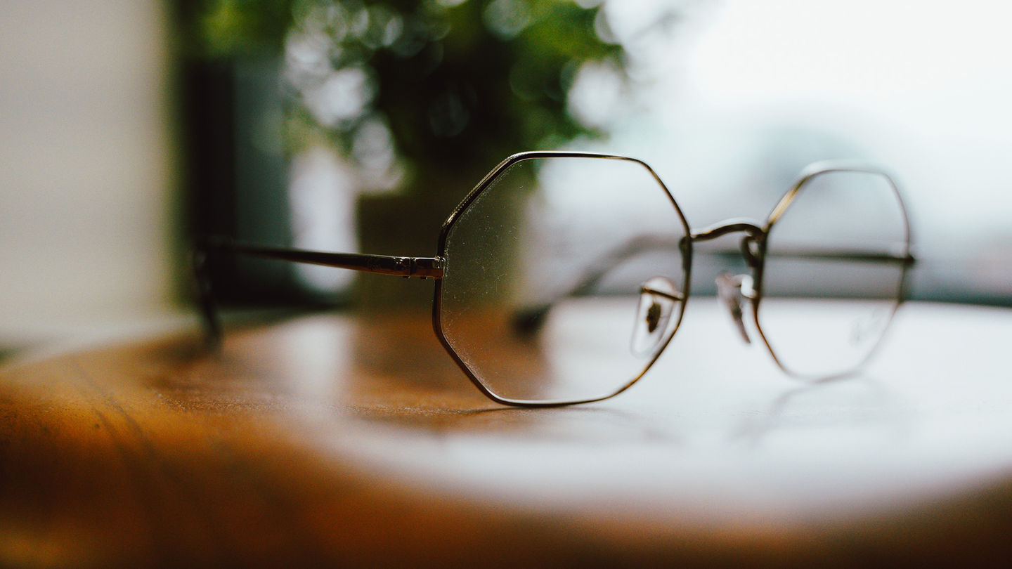 Stylish octagon glasses rest on wood