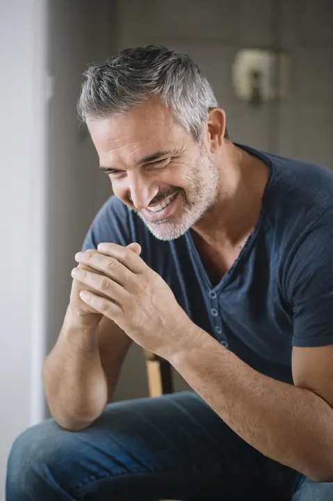 Smiling man with graying hair