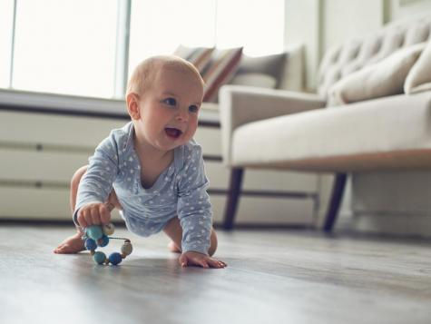 Baby crawling and about to take steps