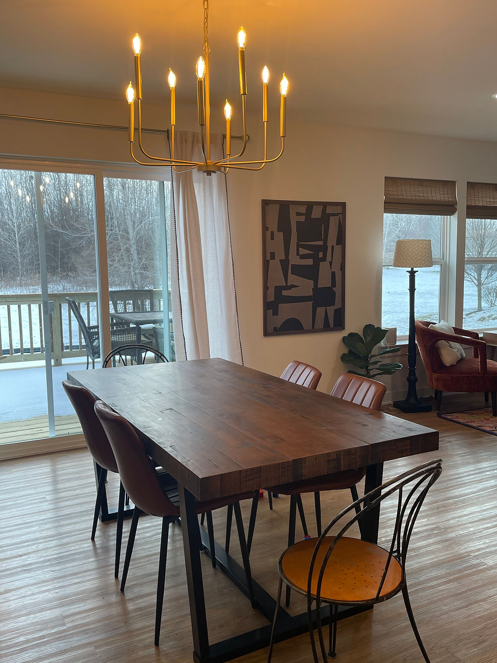 Gold Chandelier wood table with leather chairs