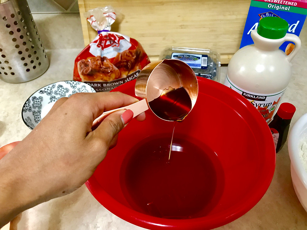 n a large bowl, mix together coconut oil and maple syrup.