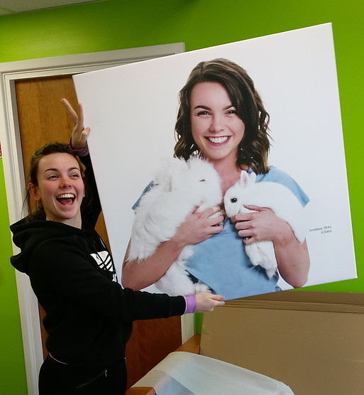 veterinary nurse holding a professional picture of herself