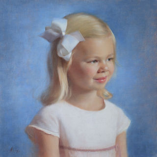 Portrait of a young girl with short blonde hear wearing a large white ribbon and white dress, blue background