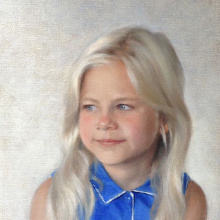 Portrait of a young girl with long blonde hear wearing a blue collared top, blue/white background