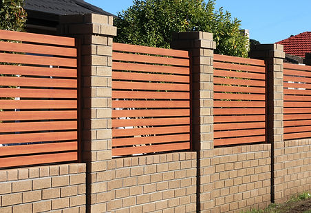 Stunning custom brick front fence with classic brick pillars and modern Veri Timber-look panels, Glen Iris property