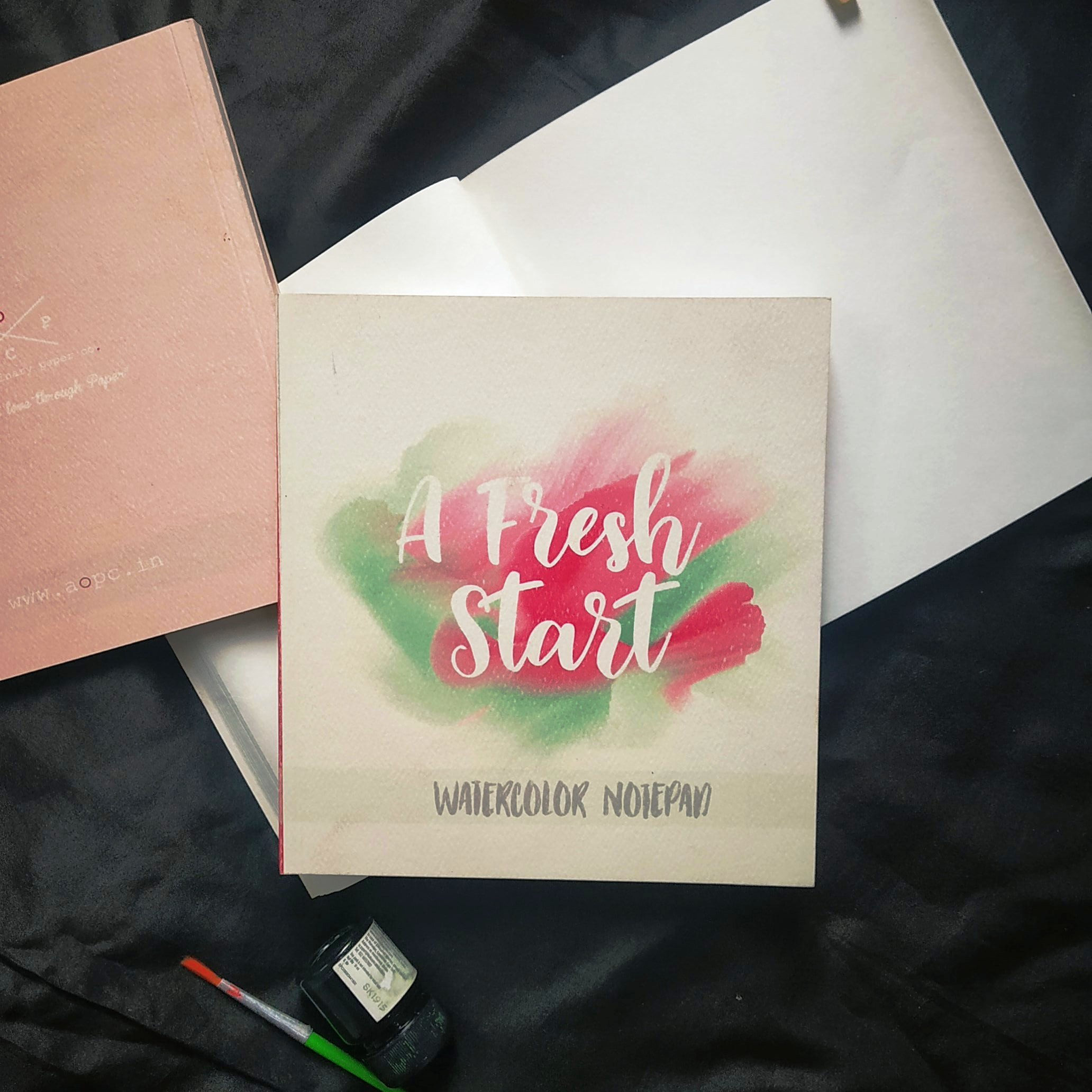 Square (6" x 6") Watercolor Journals with textured cover page.