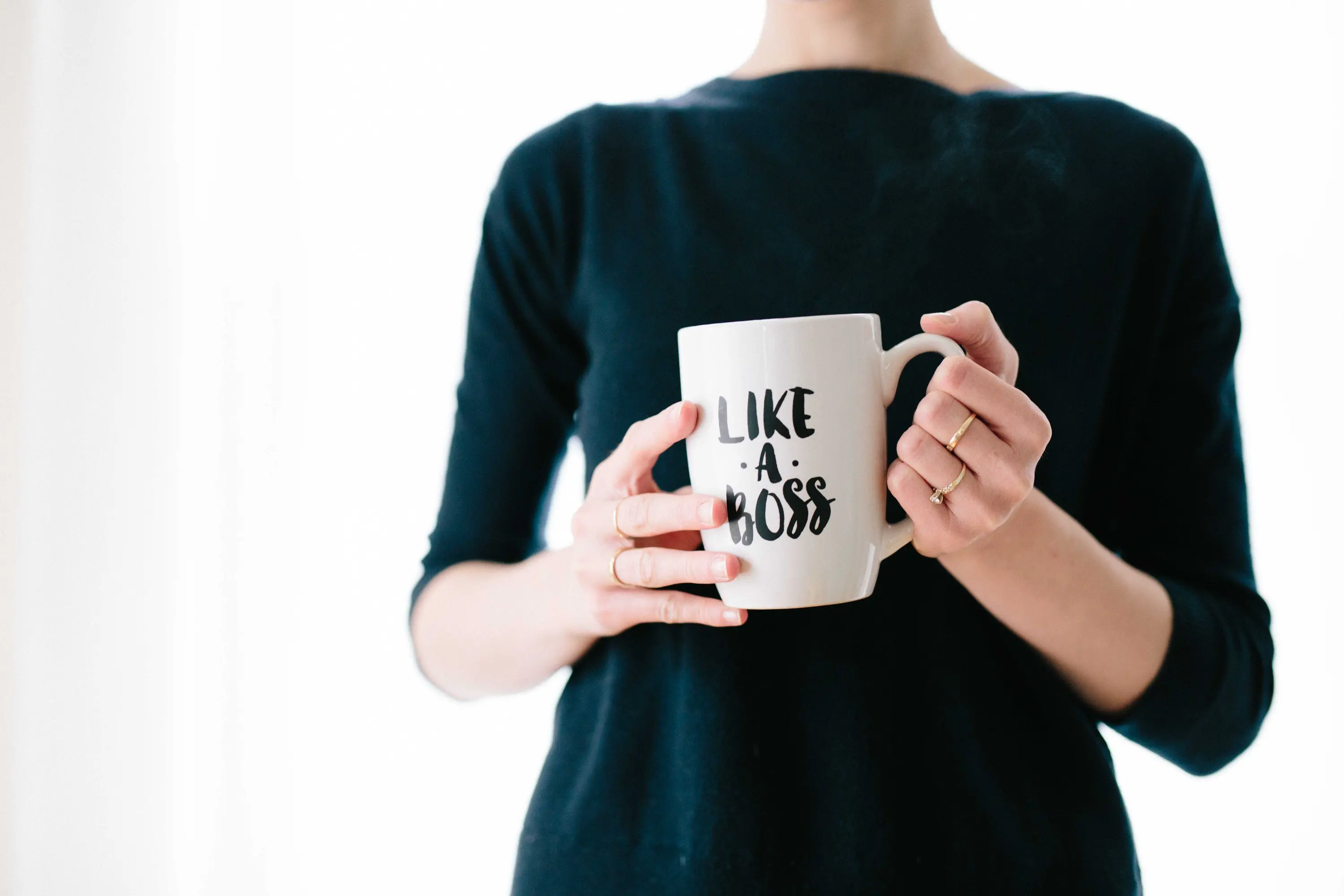 a lady with a "like a boss" mug
