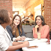 Four women working in a business meeting